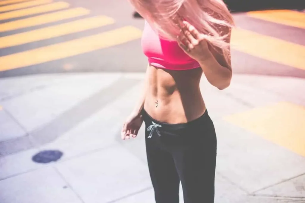 Woman with toned stomach after LA-EMS Body Sculpting Treatment Waltham's Cross